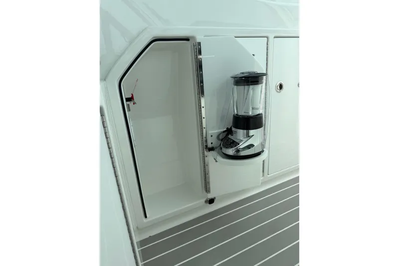 Slide: The Image of 2025 Formula 380 Super Sport Crossover OB with built-in blender in storage compartment. - 5