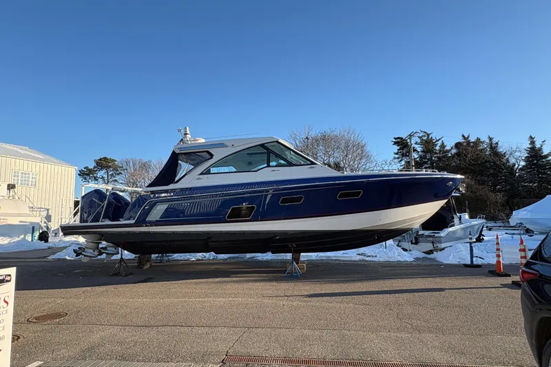 Slide: The Image of 2025 Formula 380 Super Sport Crossover OB boat on display outdoors. - 54