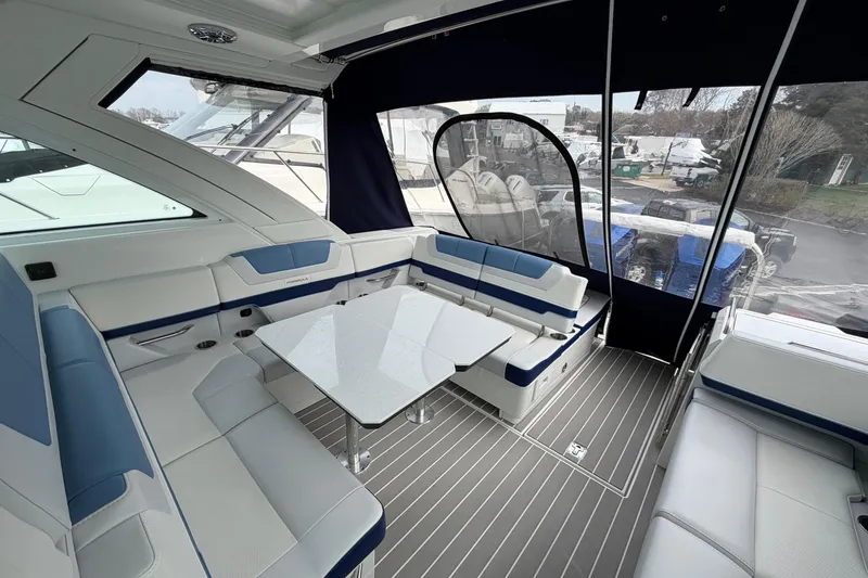 Slide: The Image of Luxurious interior of 2025 Formula 380 Super Sport Crossover OB boat with sleek seating and table. - 7