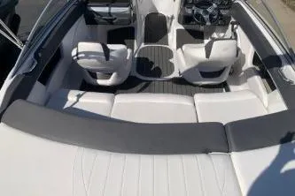 Slide: The Image of 2011 Four Winns H200 boat interior with white seating and sleek design. - 6