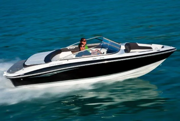 Slide: The Image of Manufacturer Provided Image: 2011 Four Winns H200 speedboat cruising on clear blue water. - 9
