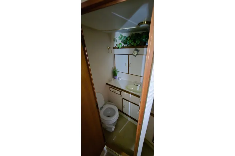 Slide: The Image of Bathroom interior of 1986 Tollycraft 34 Sundeck yacht with sink and toilet. - 44
