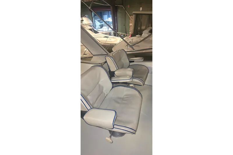 Slide: The Image of 1986 Tollycraft 34 Sundeck boat interior with cushioned seating. - 12