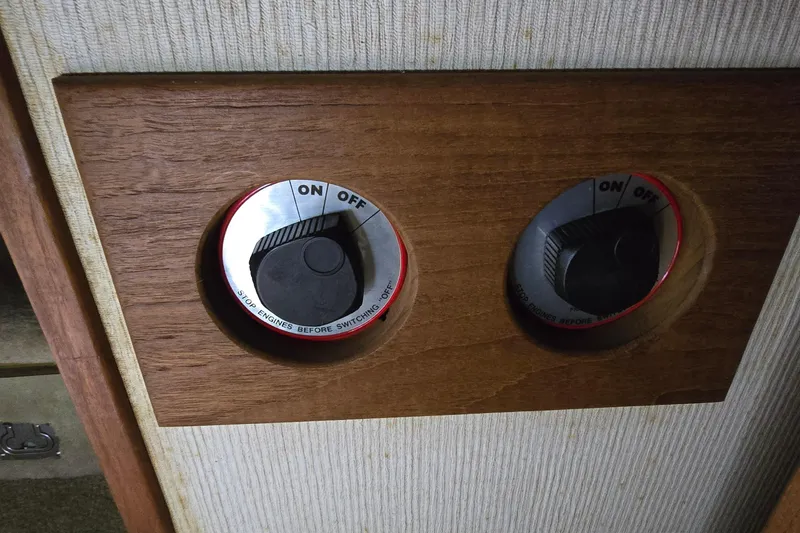 Slide: The Image of Control panel with dual switches on a 1986 Tollycraft 34 Sundeck boat. - 25