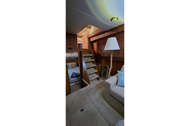 Slide: The Image of Interior of 1986 Tollycraft 34 Sundeck yacht with cozy seating and wooden accents. - 31