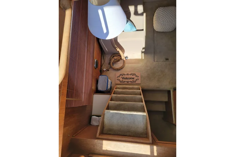 Slide: The Image of Interior of 1986 Tollycraft 34 Sundeck with stairs and welcome mat. - 51
