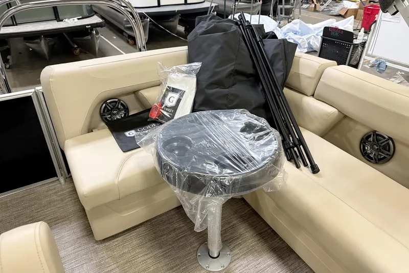 Slide: The Image of Interior of 2026 Godfrey Sweetwater 2086 C pontoon boat with beige seating and accessories. - 10