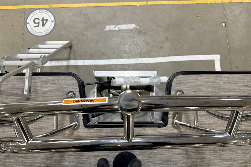 Slide: The Image of Overhead view of Godfrey Sweetwater 2086 C boat deck, featuring metal railing and warning label. - 11