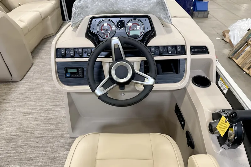 Slide: The Image of 2026 Godfrey Sweetwater 2086 C boat dashboard with steering wheel and control panel. - 7