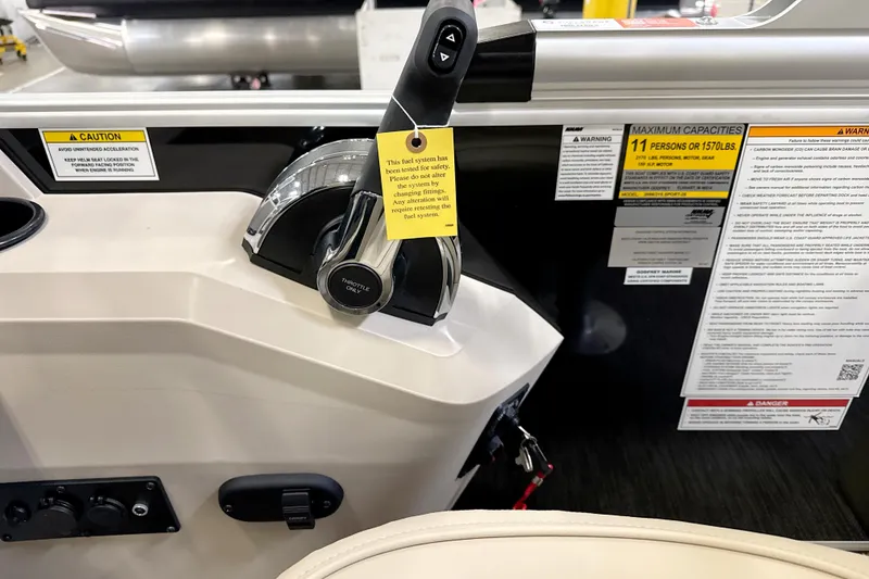 Slide: The Image of Control panel of 2026 Godfrey Sweetwater 2086 C boat with safety warnings and capacity details. - 8