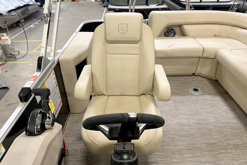 Slide: The Image of Captain's chair and helm of 2026 Godfrey Sweetwater 2086 C pontoon boat. - 9