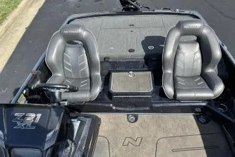 Slide: The Image of 2023 Nitro Z21 XL boat interior with dual gray seats and steering console. - 3
