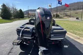 Slide: The Image of 2023 Nitro Z21 XL boat with powerful outboard motor on a sunny day. - 5