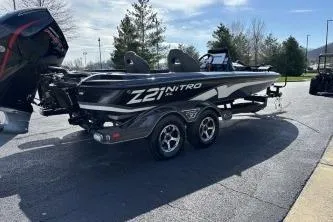 Slide: The Image of 2023 Nitro Z21 XL boat on trailer, parked outdoors. - 6