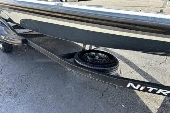 Slide: The Image of 2023 Nitro Z21 XL boat trailer with spare tire on asphalt. - 7