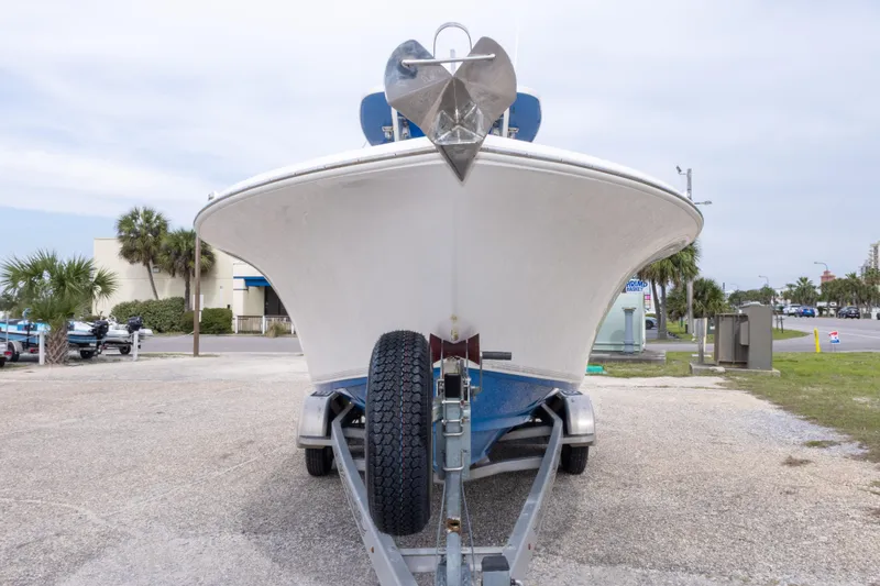 Slide: The Image of 2016 Key West 244 Center Console boat on trailer, parked outdoors. - 10