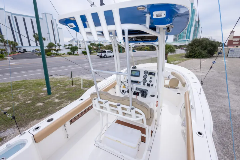 Slide: The Image of 2016 Key West 244 Center Console boat with modern dashboard and seating. - 12