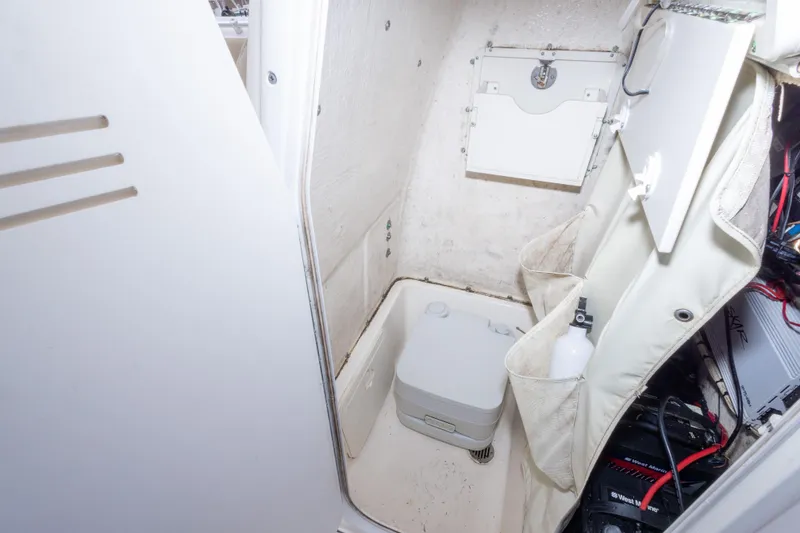Slide: The Image of Interior of a 2016 Key West 244 Center Console boat with storage and equipment. - 21