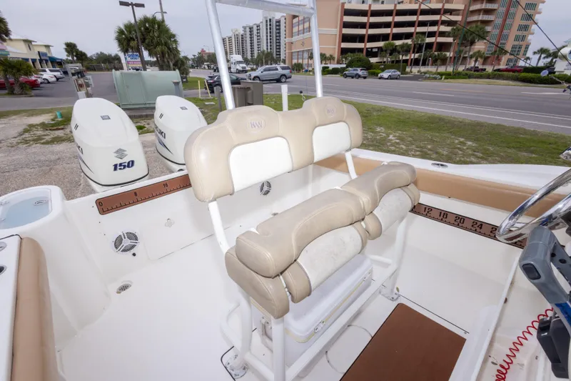 Slide: The Image of 2016 Key West 244 Center Console boat interior with dual Suzuki 150 engines. - 28