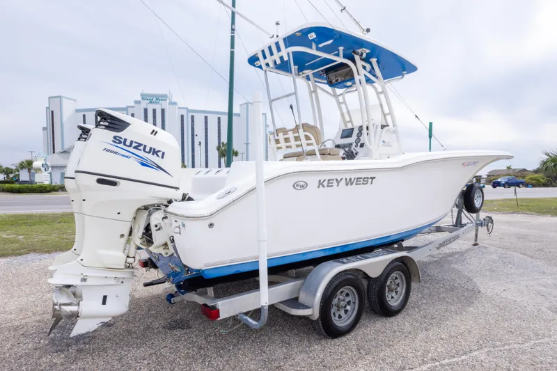 Slide: The Image of 2016 Key West 244 Center Console boat with Suzuki engine on a trailer. - 3