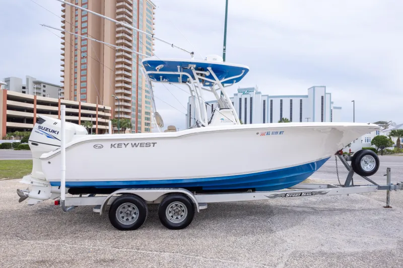 Slide: The Image of 2016 Key West 244 Center Console boat on trailer, urban background. - 4