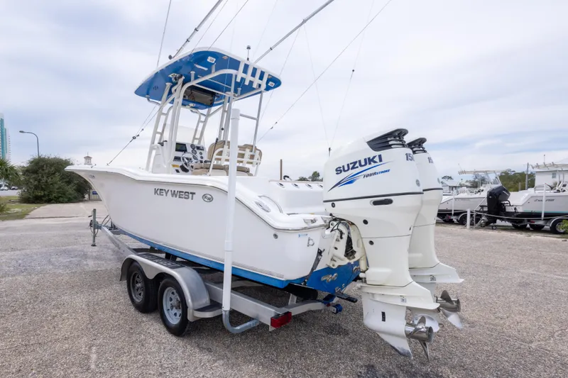 Slide: The Image of 2016 Key West 244 Center Console boat with Suzuki engines on a trailer. - 7