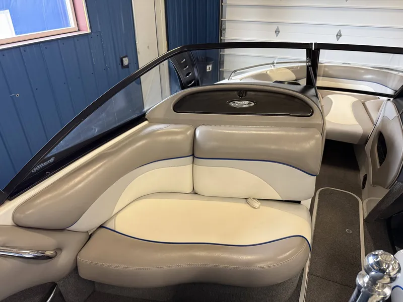 Slide: The Image of Interior of a 2007 Malibu Response LXi boat with beige seating. - 10
