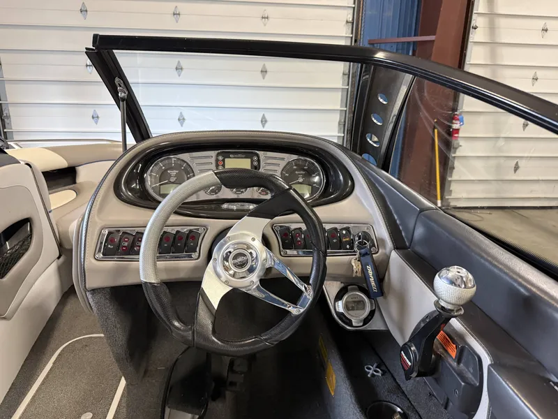 Slide: The Image of Interior view of a 2007 Malibu Response LXi boat cockpit. - 12