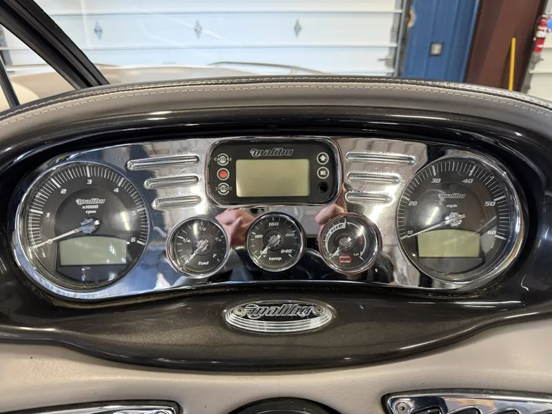 Slide: The Image of Dashboard of a 2007 Malibu Response LXi with gauges and displays. - 13