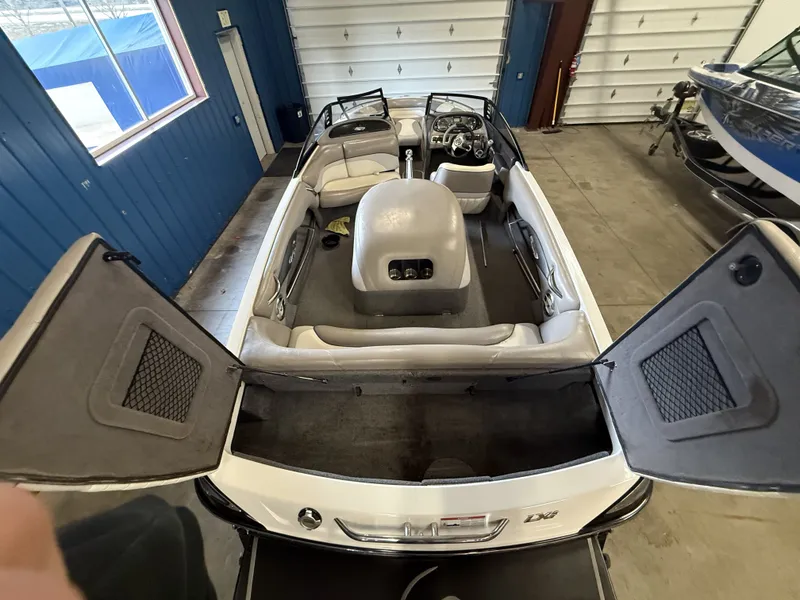Slide: The Image of Interior view of a 2007 Malibu Response LXi boat in a garage. - 22