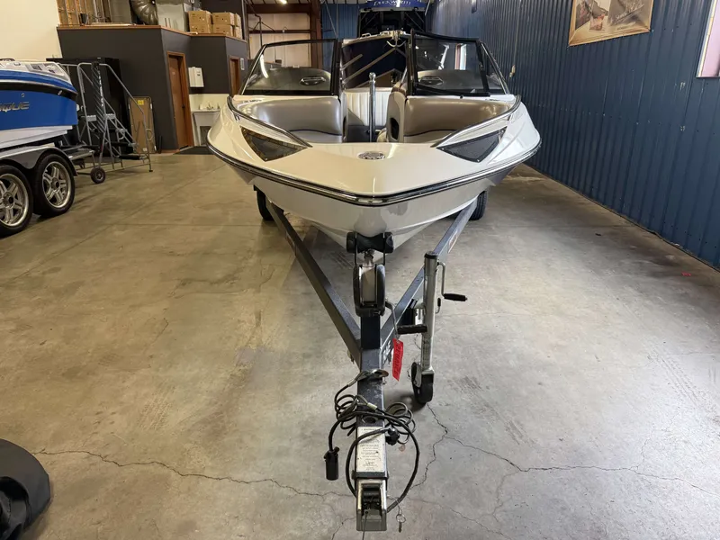 Slide: The Image of 2007 Malibu Response LXi boat in warehouse on trailer. - 3