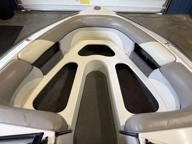 Slide: The Image of Interior of a 2007 Malibu Response LXi boat with gray and white seating. - 9