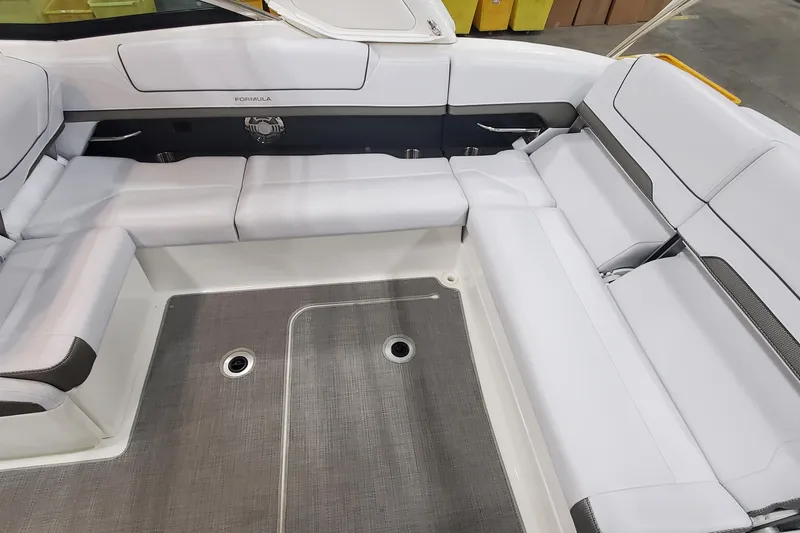 Slide: The Image of 2017 Formula 310 Bowrider interior with white seating and gray flooring. - 10