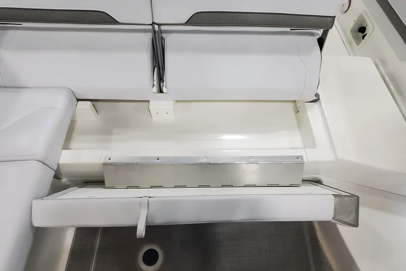 Slide: The Image of 2017 Formula 310 Bowrider interior seating with storage compartment open. - 12