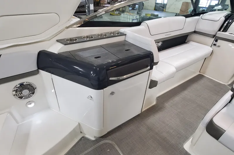 Slide: The Image of 2017 Formula 310 Bowrider interior with seating and built-in amenities. - 14