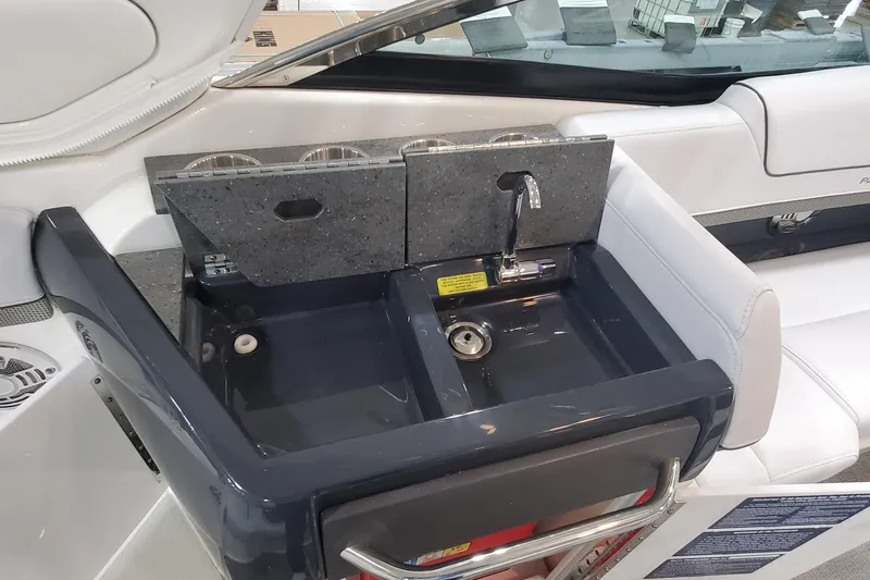 Slide: The Image of 2017 Formula 310 Bowrider boat sink with faucet and countertop. - 16