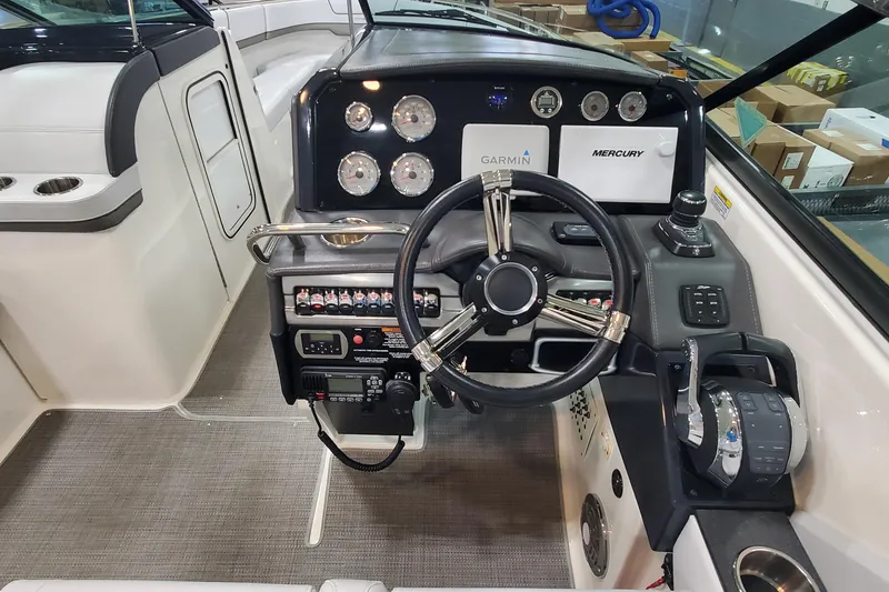 Slide: The Image of 2017 Formula 310 Bowrider helm with Garmin and Mercury controls. - 18