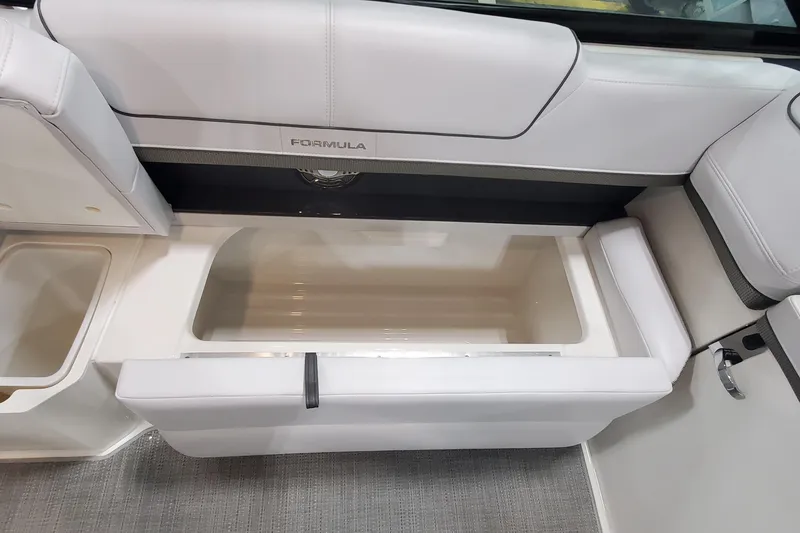 Slide: The Image of 2017 Formula 310 Bowrider interior storage compartment with cushioned seating. - 22