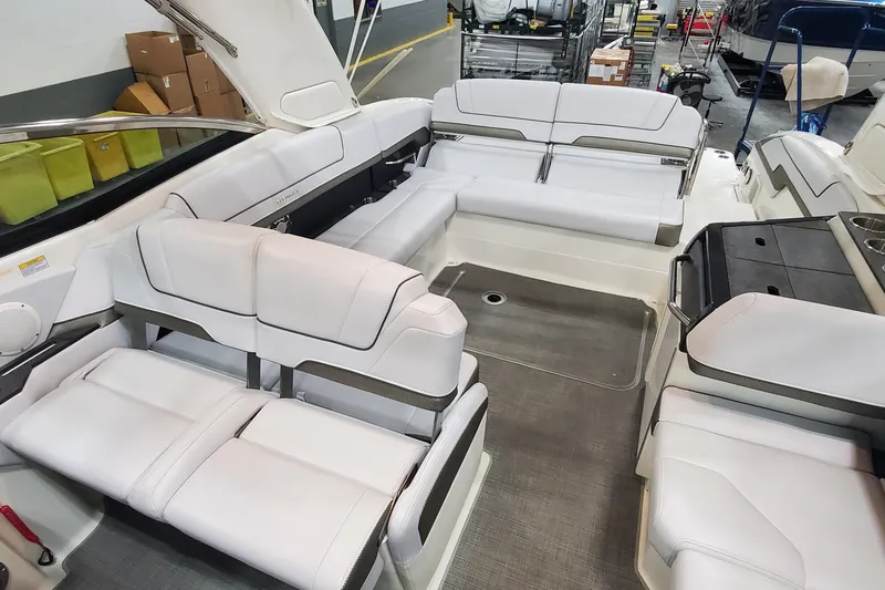 Slide: The Image of 2017 Formula 310 Bowrider interior with white seating and spacious layout. - 23