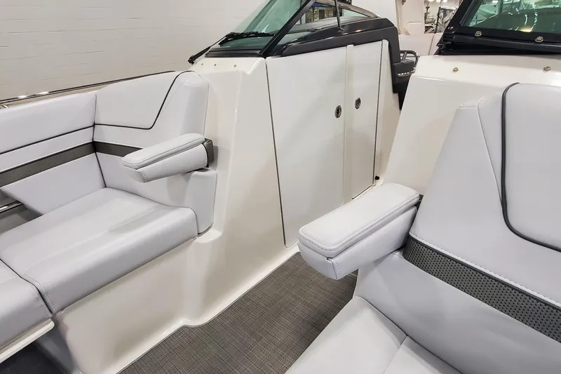 Slide: The Image of 2017 Formula 310 Bowrider interior with sleek white seating and armrests. - 30