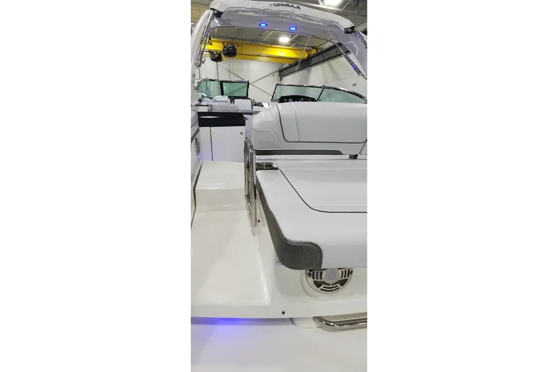 Slide: The Image of 2017 Formula 310 Bowrider boat interior with sleek white seating and modern design. - 35