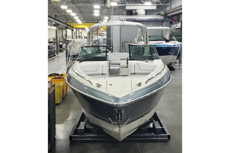 Slide: The Image of 2017 Formula 310 Bowrider boat in a showroom, front view. - 4