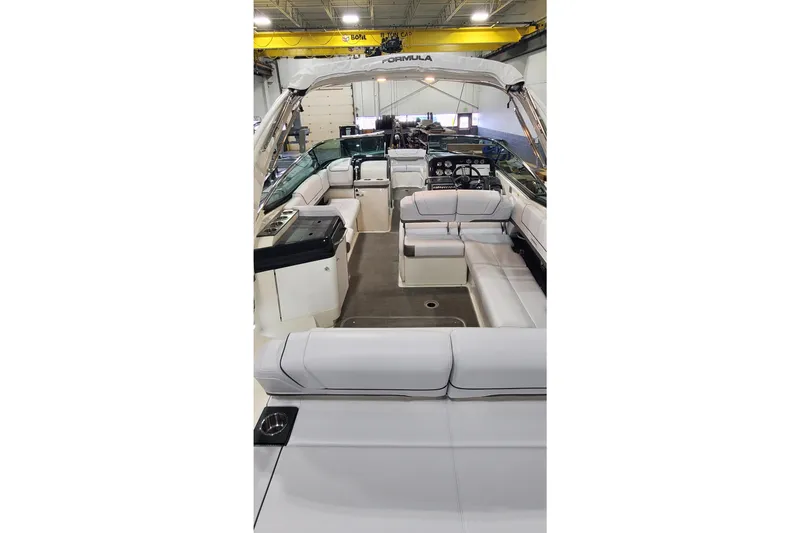 Slide: The Image of 2017 Formula 310 Bowrider interior with spacious seating and modern dashboard. - 5