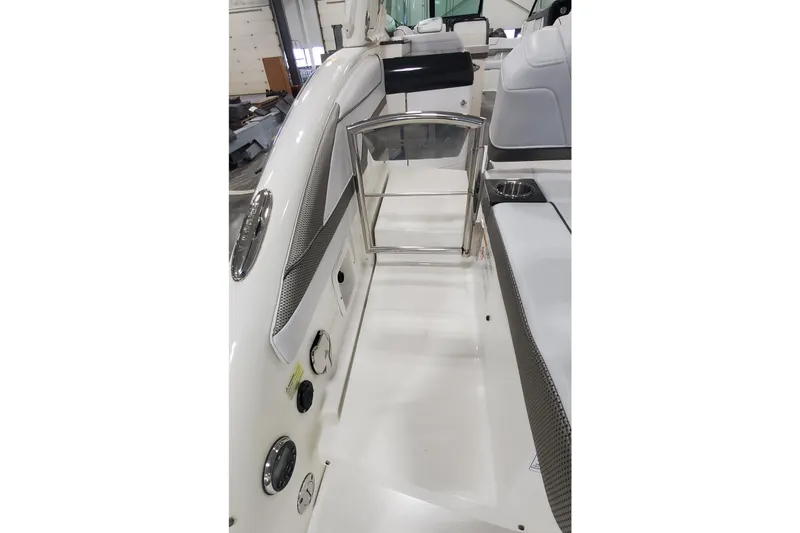 Slide: The Image of 2017 Formula 310 Bowrider interior with seating and stainless steel accents. - 8