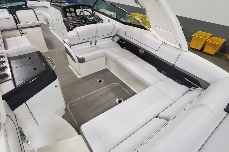 Slide: The Image of 2017 Formula 310 Bowrider interior with spacious seating and modern dashboard. - 9