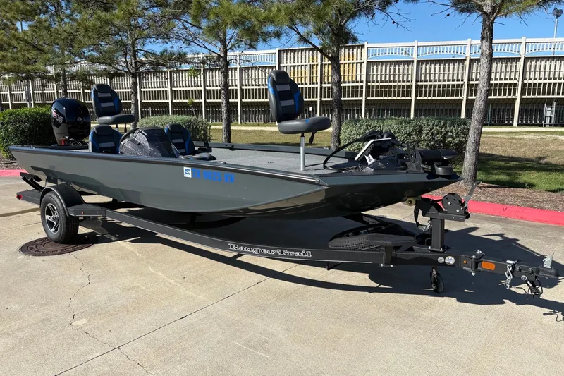 The Image of 2024 Ranger RT198P fishing boat on trailer, parked outdoors. - 0