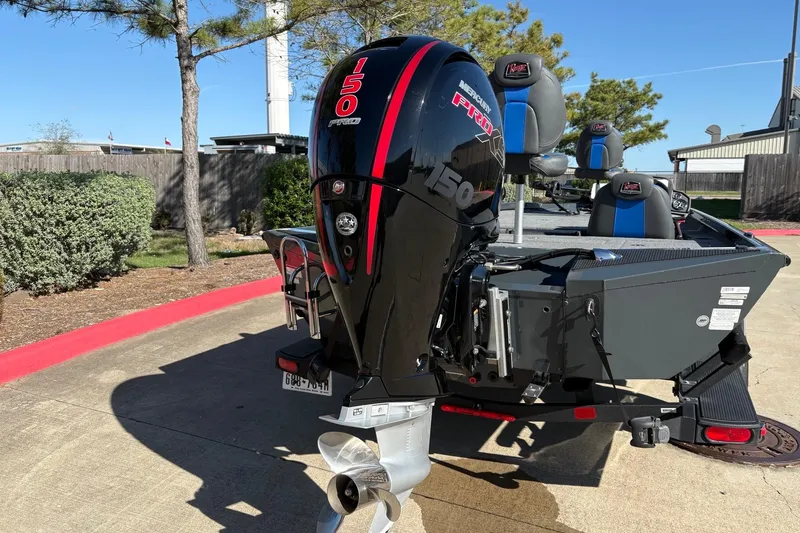 Slide: The Image of 2024 Ranger RT198P boat with Mercury 150 Pro XS engine in a sunny outdoor setting. - 8