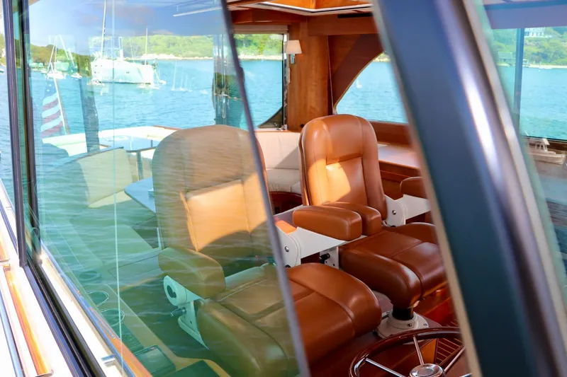 Slide: The Image of Interior view of 2026 Hinckley Talaria 48 MKII yacht with leather seating. - 14