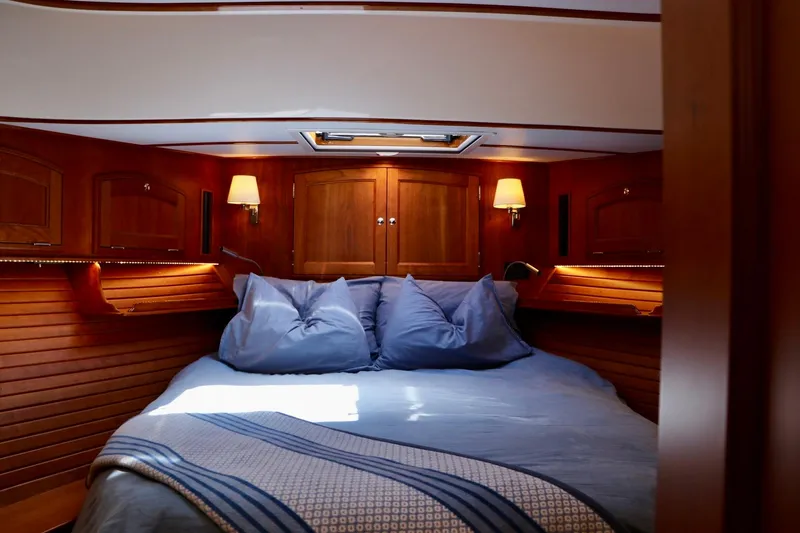 Slide: The Image of Luxurious cabin interior of 2026 Hinckley Talaria 48 MKII yacht with cozy bedding. - 18