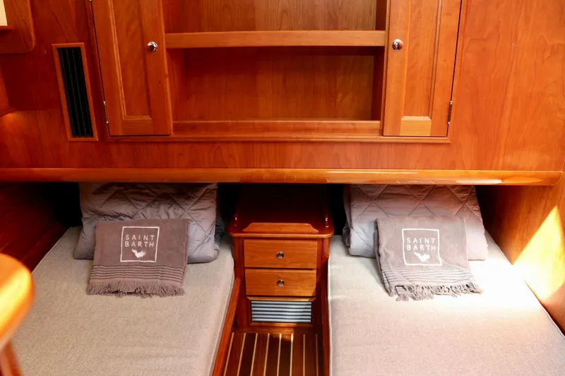 Slide: The Image of Luxurious cabin interior of 2026 Hinckley Talaria 48 MKII yacht with twin beds. - 19